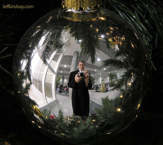 Self-portrait in a Christmas ornament, Green Bay International Airport, Jan, 2006.