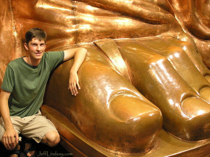 Ben at the feet from a model for the Statue of Liberty inside the museum on Staten Island, New York, July  2007.
