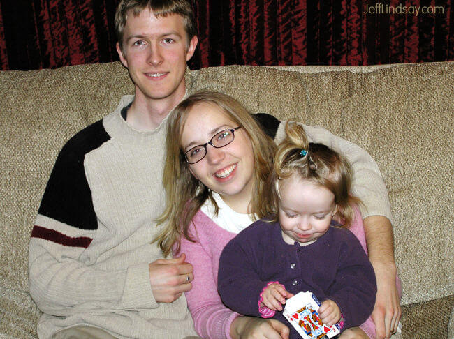 Anna works on a new card trick for her parents, Stephen and Meliah.