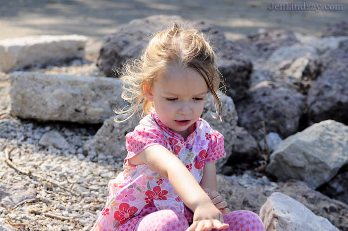 throwing rocks while on the shore of a lake or river. Here she is at the shore of Green Bay at Bay Beach Park in Green Bay, Wisconsin.