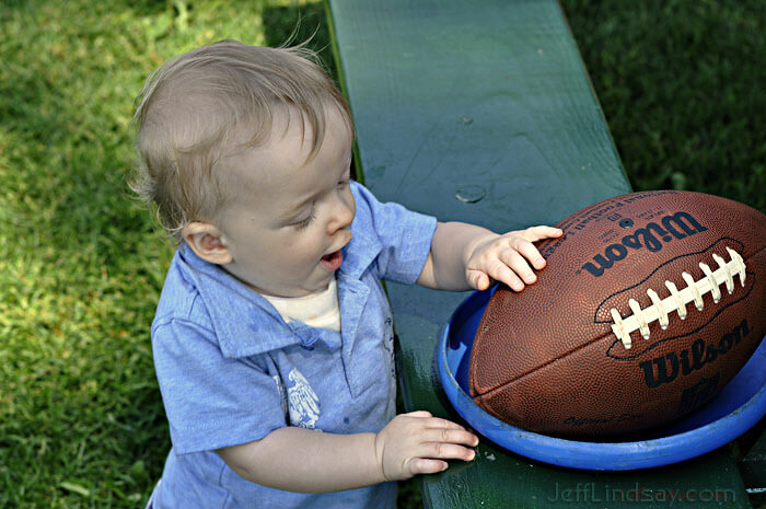 Now I know what the purpose of life is! My grandson makes an important discovery. Taken at a family picnic at Bay Beach Park in Green Bay, summer of 2009. 