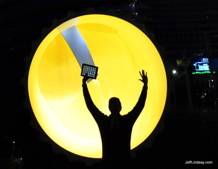 Jeff waves his iPad triumphantly in front of a monument in downtown  Seoul, Korea, October 2011.