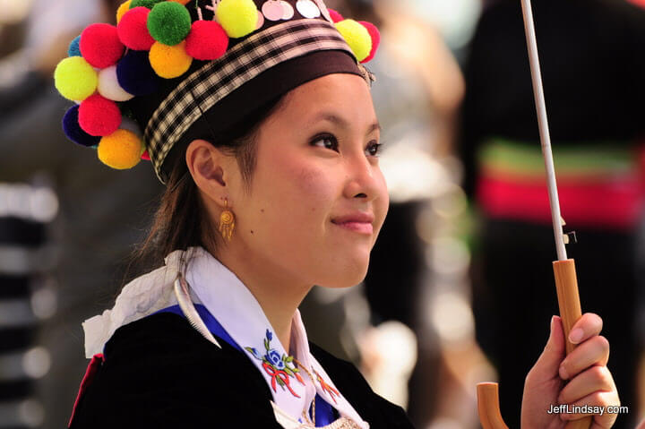 Hmong girl holding an umbrella. 