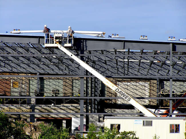 Men at work on a building in Neenah, Wisconsin (probably on the border with Menasha), May 16, 2006.