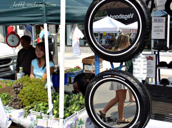 A Hmong booth at the farmers market on College Avenue, Sept. 4, 2004, featured two interesting mirrors.