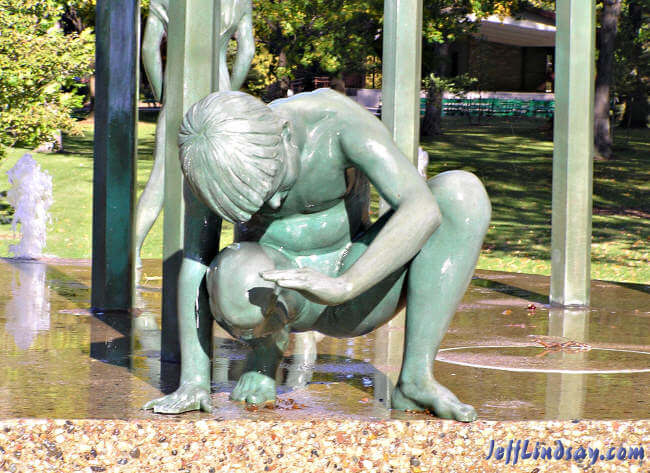 Detail of a boy in the sculpture.