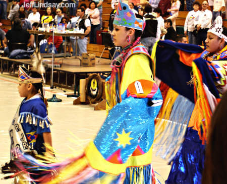 The Princess of the Pow Wow and two other girls dancing.
