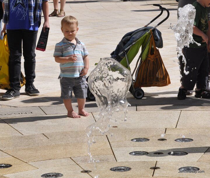 A child watched a water fountain send up a burst of water at Salt Lake City's beautiful City Creek Mall, May 2012.