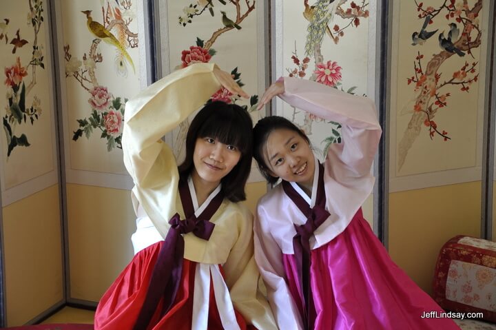 Two girls trying out Korean robes in a Korean teahouse at a cultural center in Seoul, Korea, October 2011.