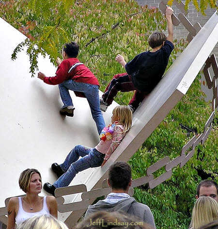 Children playing on the Metamorphosis sculpture in Houdini Square, Appleton, during Octoberfest 2006.