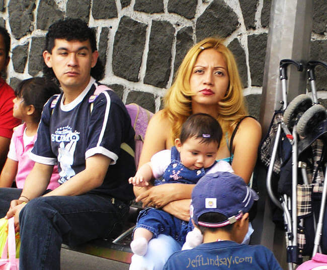 Woman and others waiting for a bus in Mexico City, March 21, 2006.