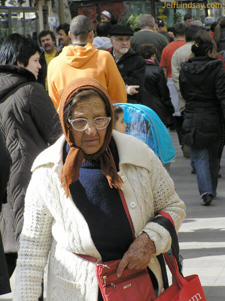 Woman on the famous and iconic street, La Rambla in Barcelona, Spain. March 2008.