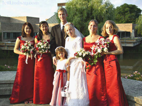 Stephen, Meliah, and her bridesmaids, at the entrance of the Chicago Botanic Gardens.