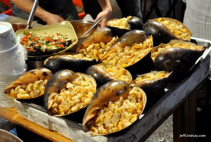 Xiamen, Fujian China, April 2013: shells being cooked