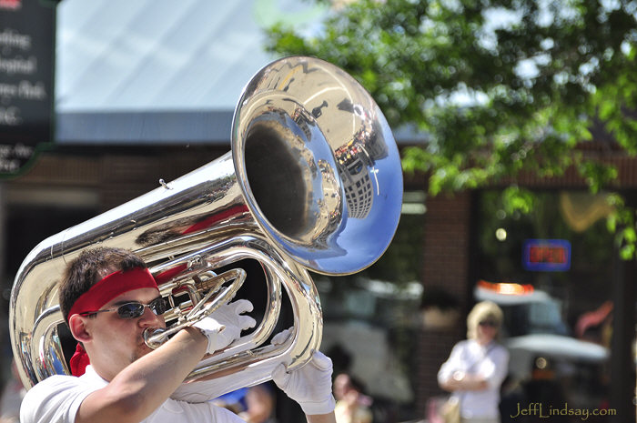 Tuba reflecting Appleton in the Los Americanos band.